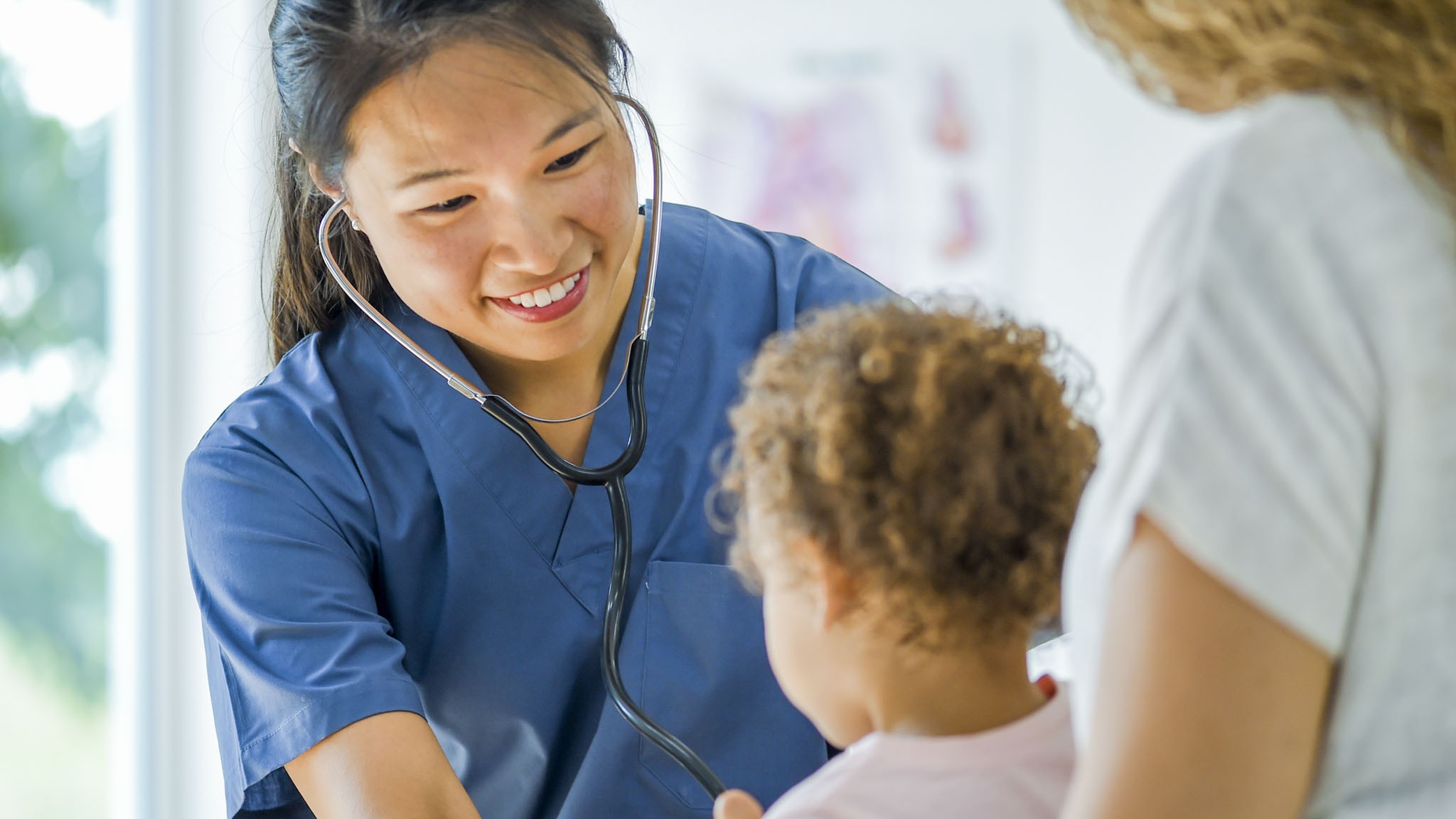A nursing student in the Primary Care Certificate program interacts with a patient.
