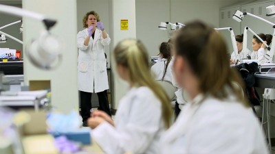 Three women working in a lab