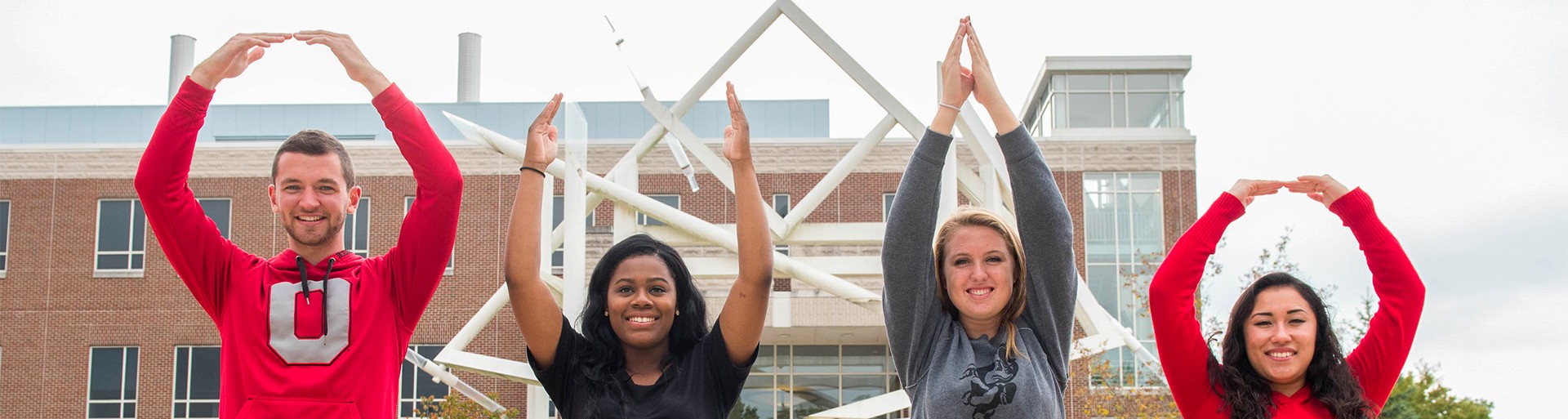 Ohio State students forming O-H-I-O with their arms