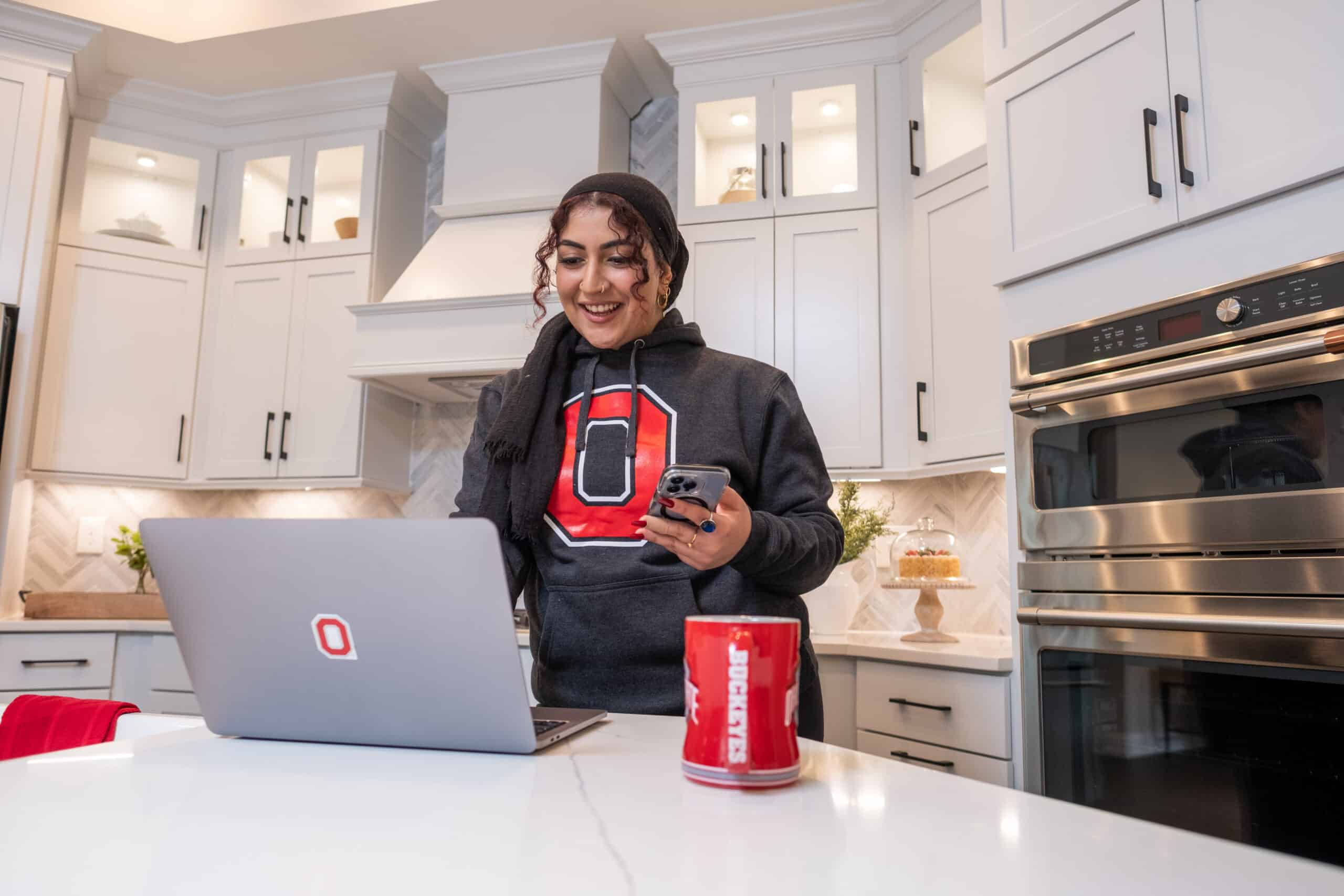student in kitchen working