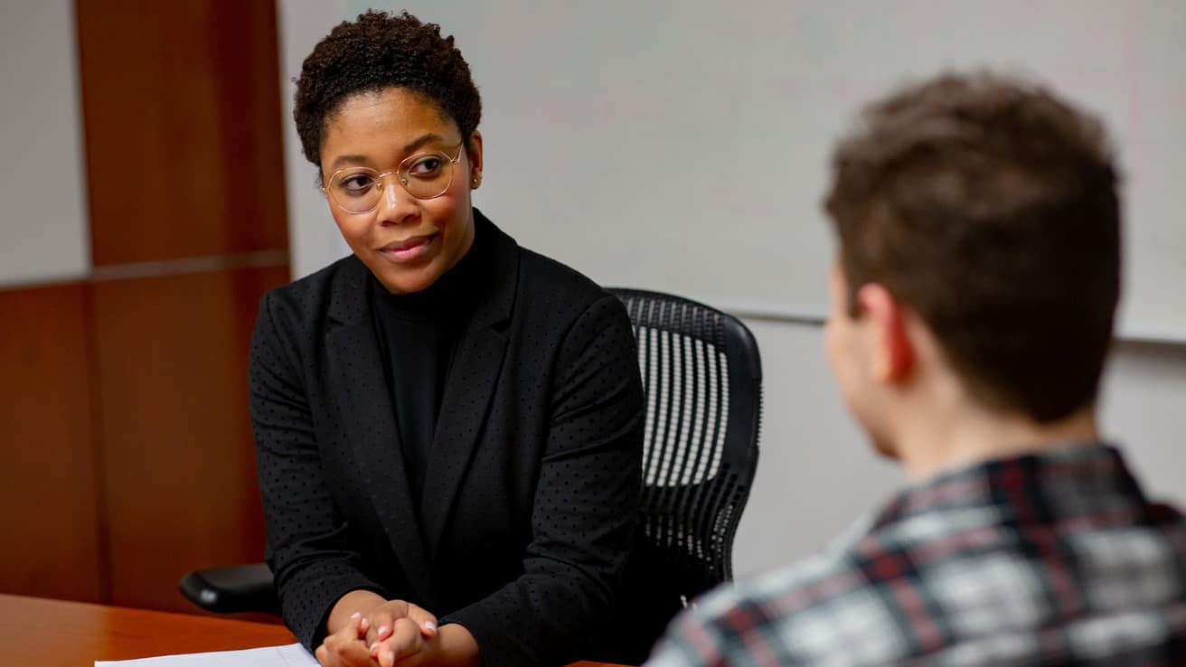 Social worker assisting a client.