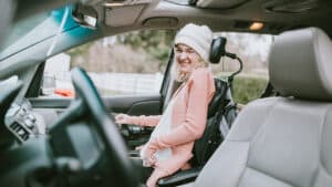 woman in vehicle in motorized wheelchair