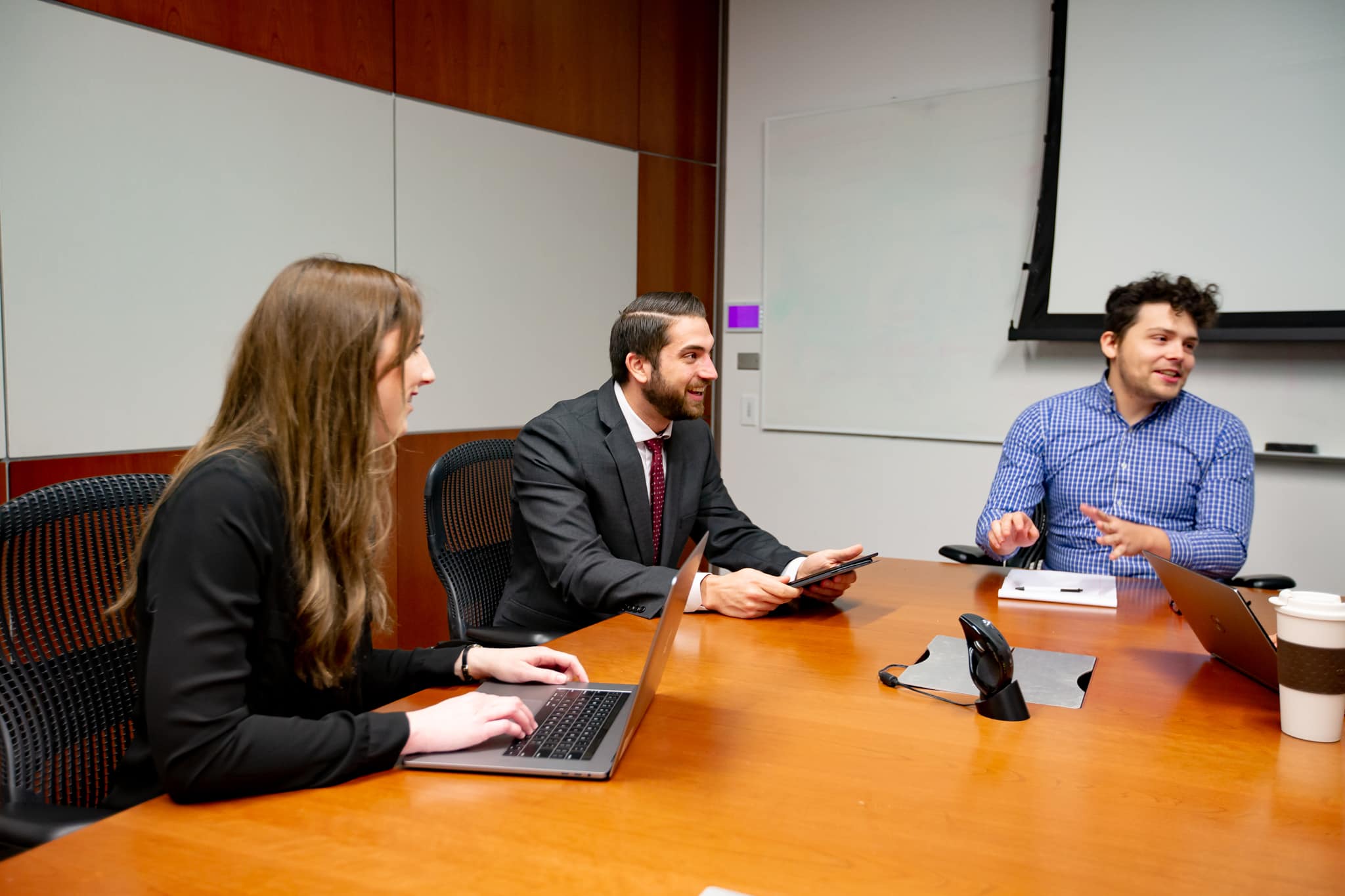 Online MBA students collaborate in a group project.
