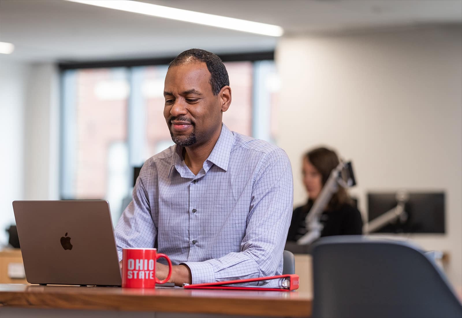 Ohio State Online learner works at laptop