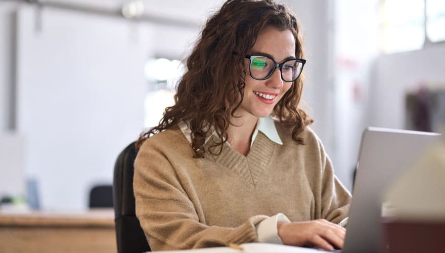 Female student using a laptop.