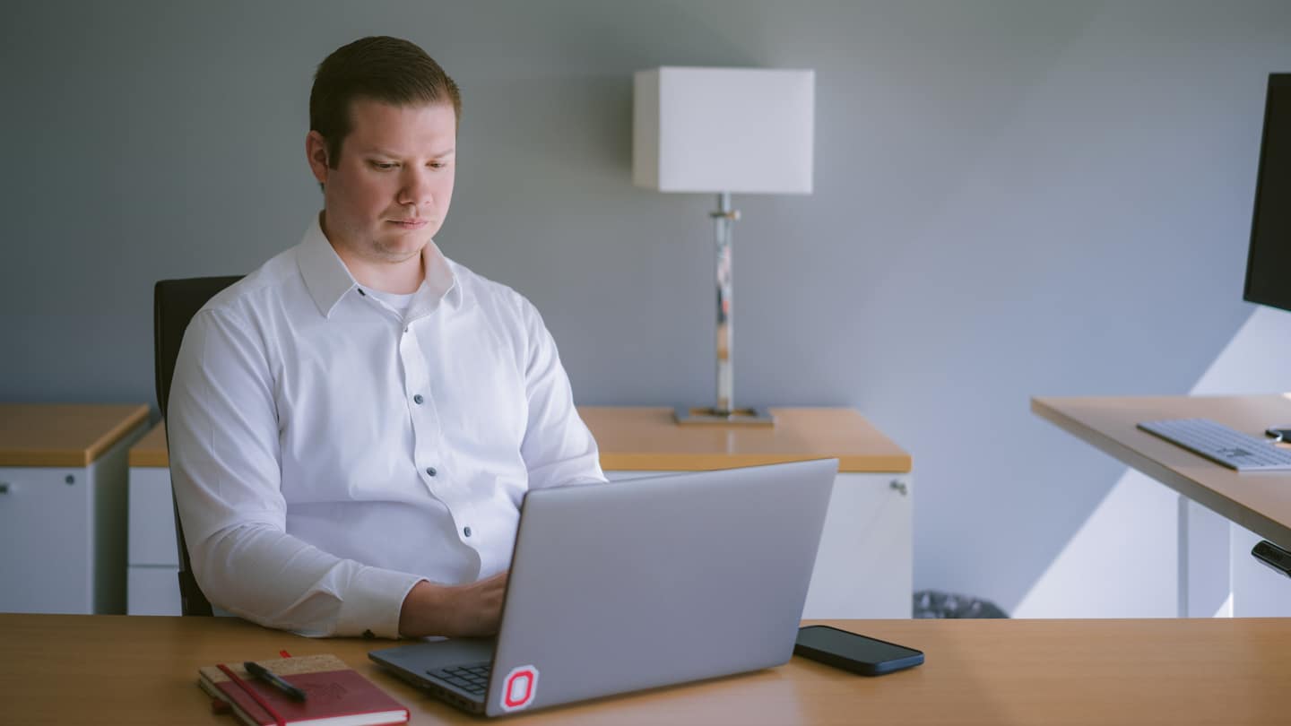 An Ohio State Master of Systems Engineering student works on a project.
