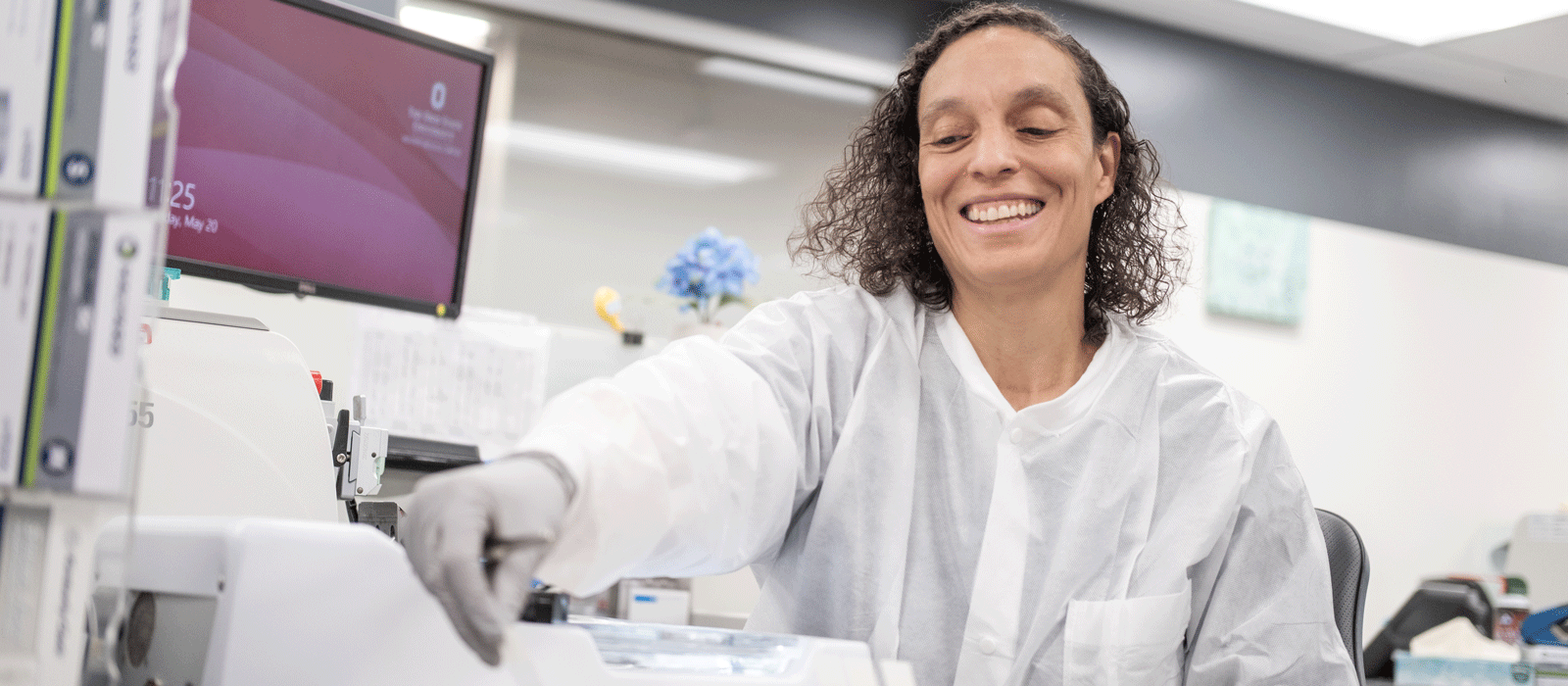 Tiffany Pinto in the lab preparing glass slides.