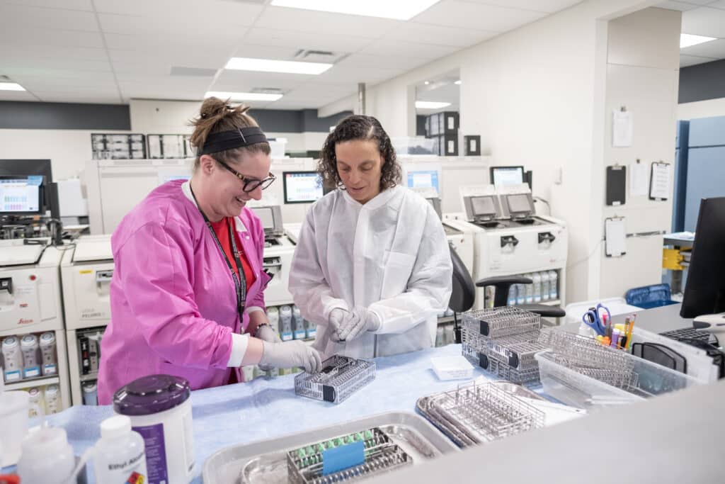 Tiffany in the lab doing a slide handoff.