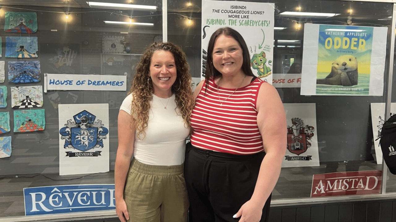 Elena Schmitt (left) smiles with Kelsey Dunn (right) during career day at World Languages Middle Schoo.