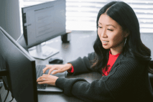 Ohio State student studying cybersecurity online on a laptop