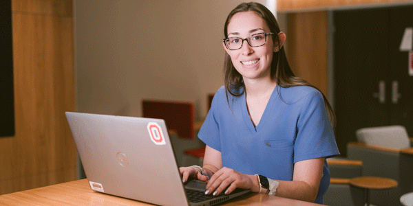 Female imaging technologist using a laptop
