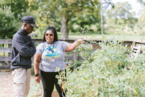 ABA student working with a client in a community garden as part of a BCBA fieldwork placement