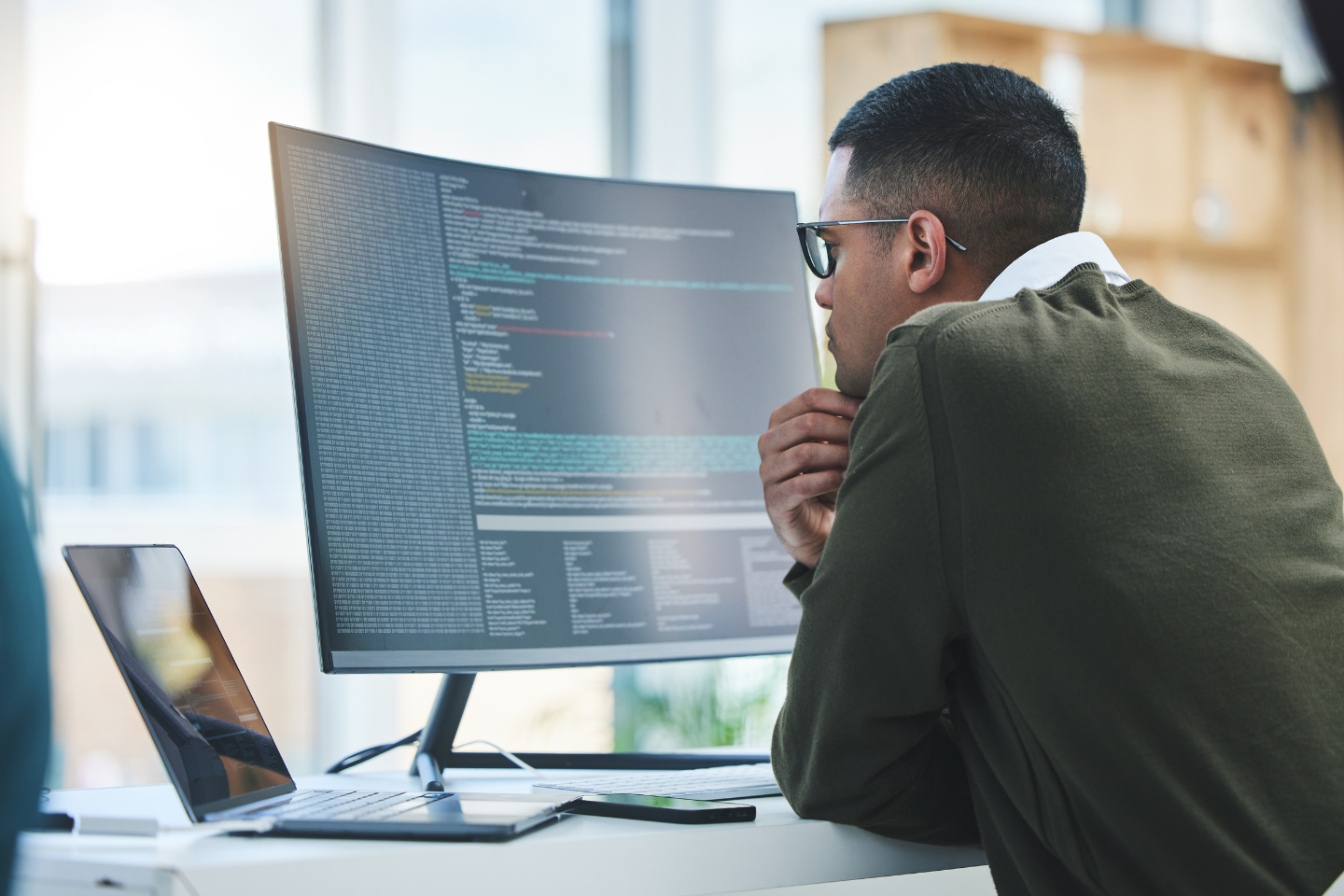 Cybersecurity professional working on a computer