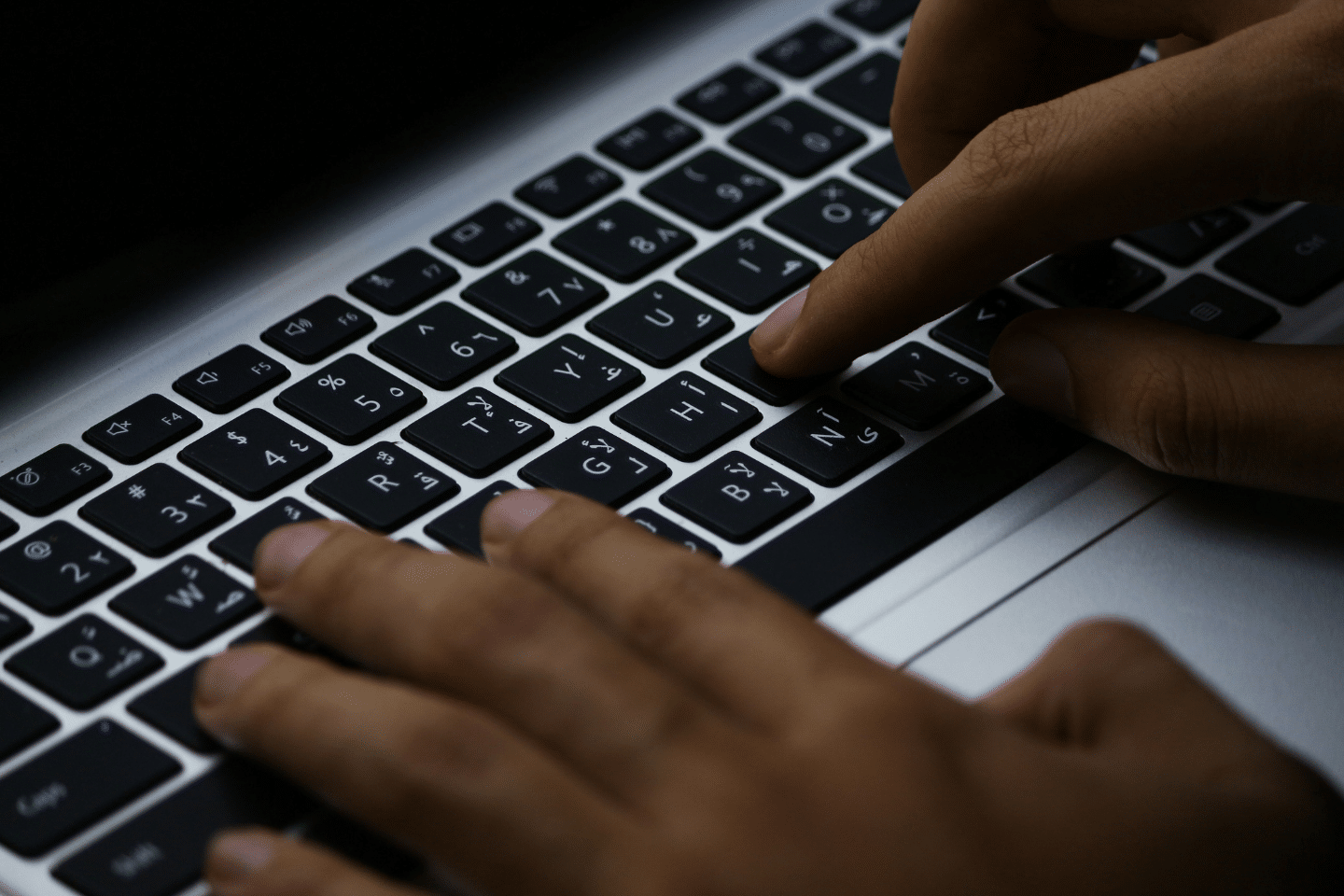 Cybersecurity professional working on a computer